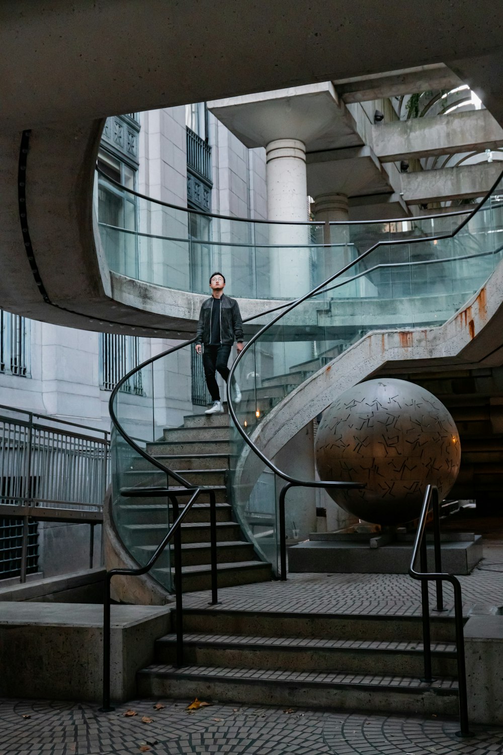 man walking on stairs close-up photography