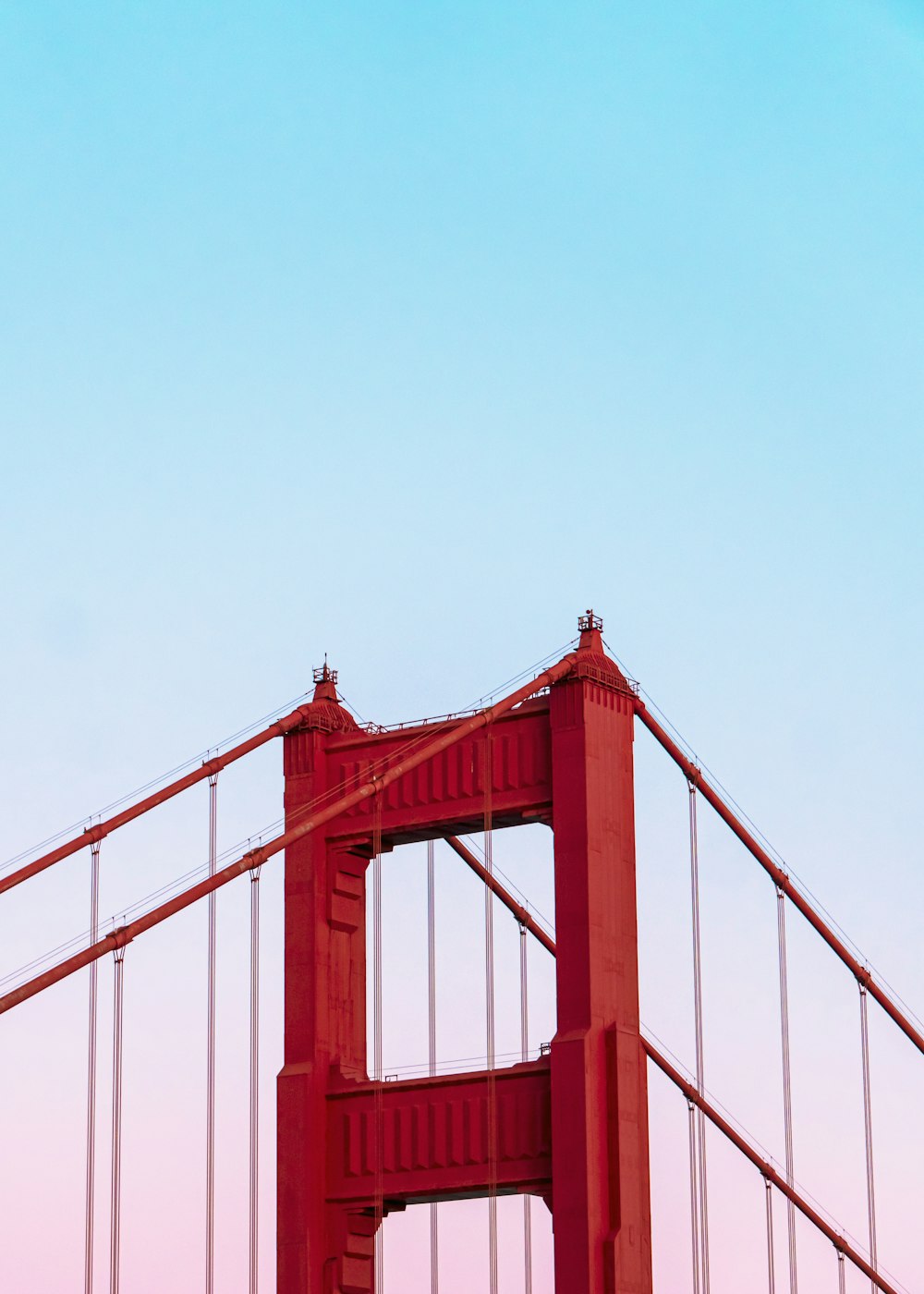Golden Gate Bridge under a calm blue sky