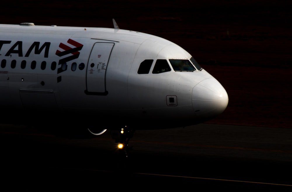 white airplane on runway