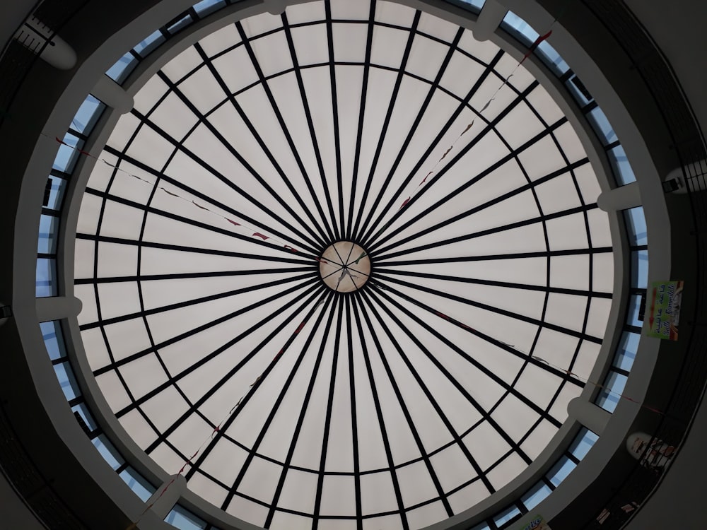 a circular glass window in the ceiling of a building