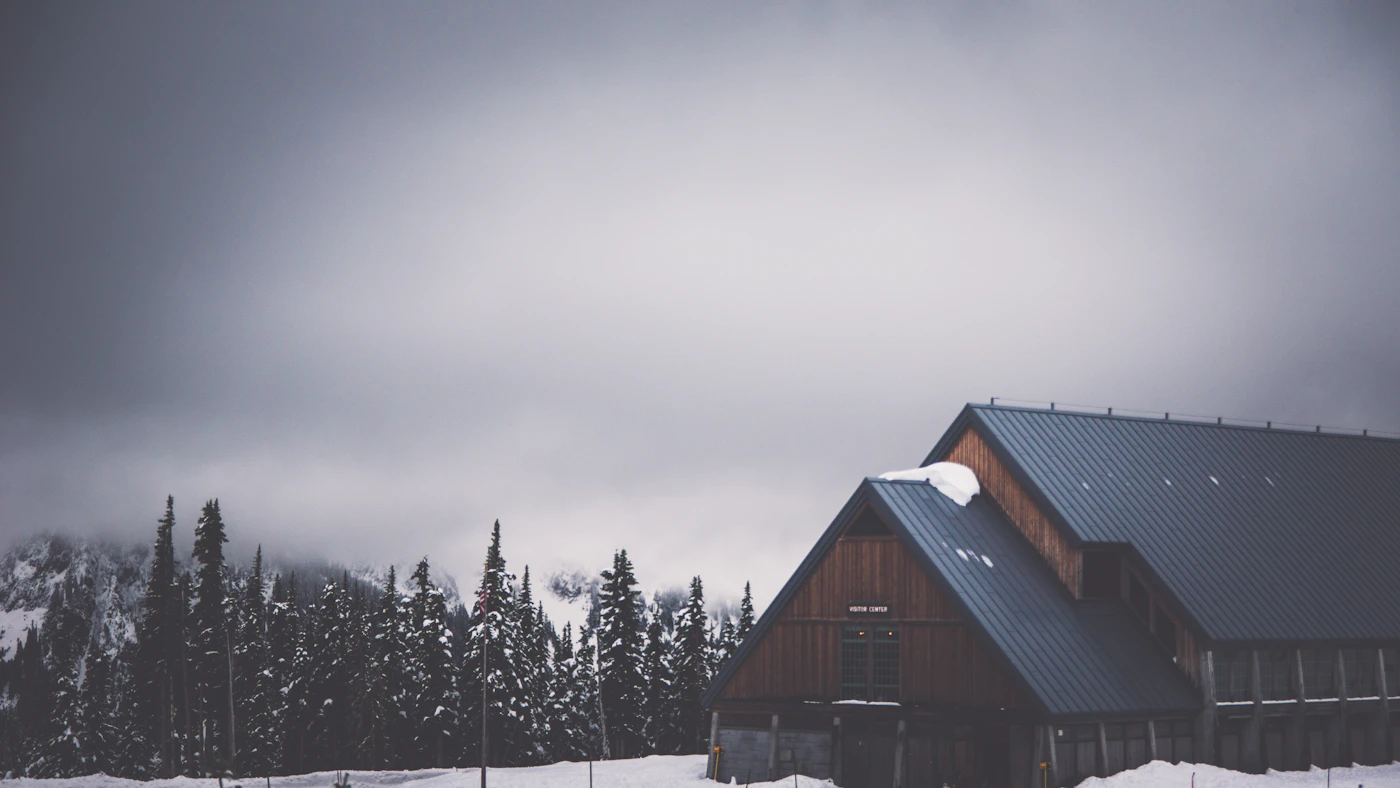 Rural house surrounded by snow in winter