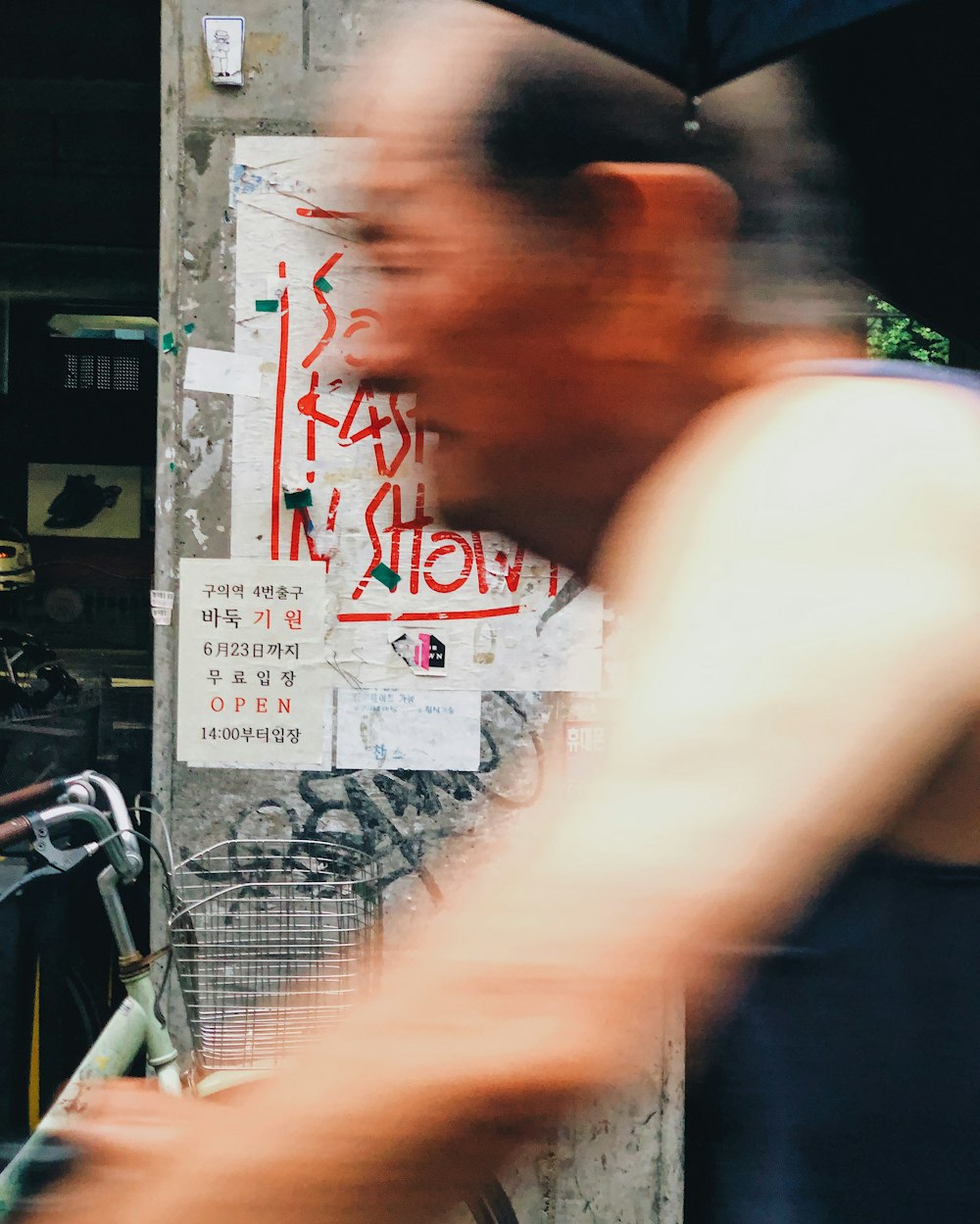 time-lapse photography of man passing by a street