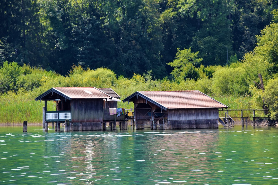 two wooden cottages at the lake