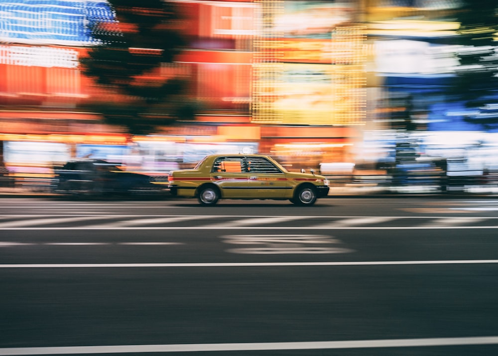 yellow taxi cab on the street