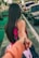 woman in pink dress and black tote bag