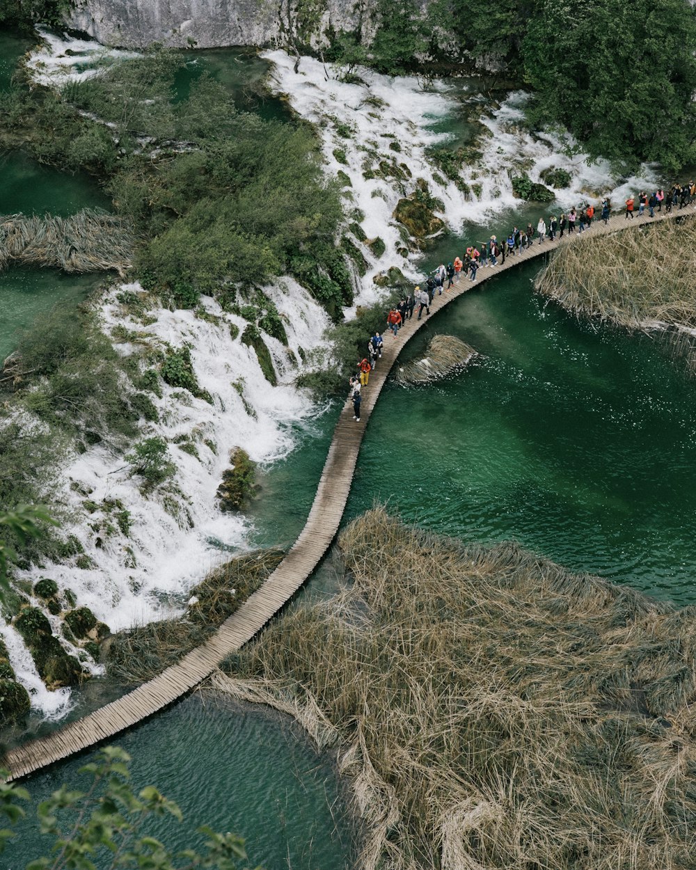 people walking on bridge