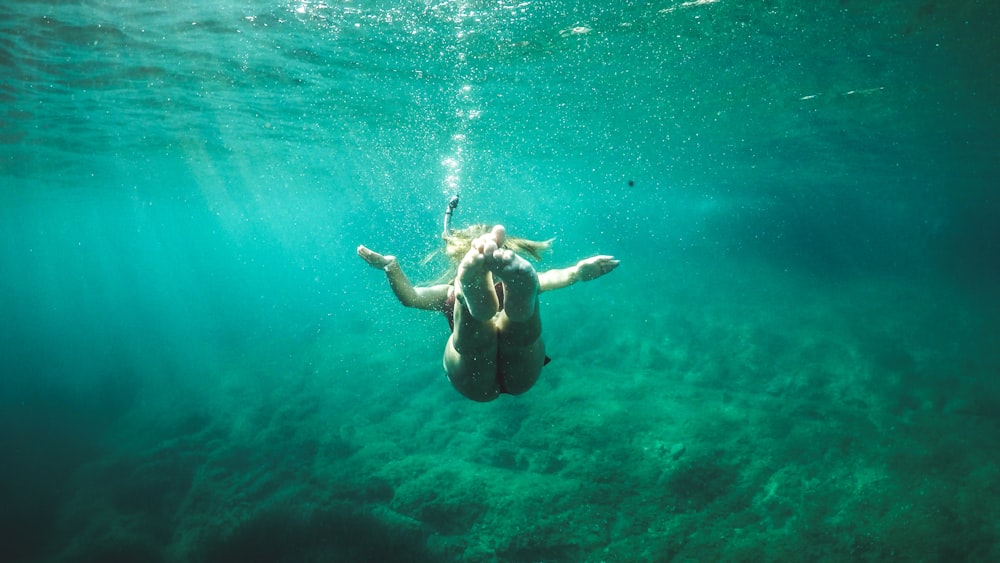 closeup photo of woman diving