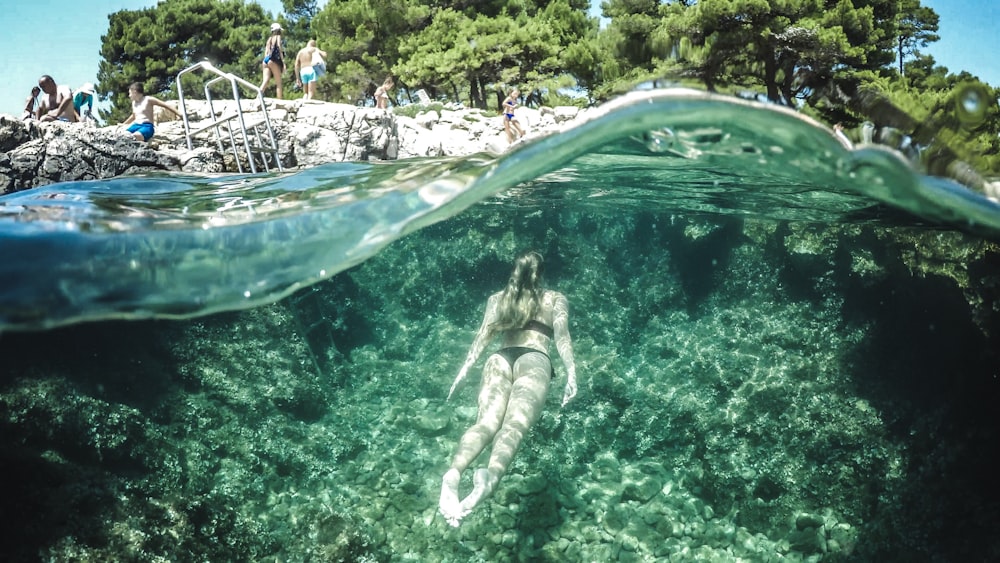 woman swimming underwater