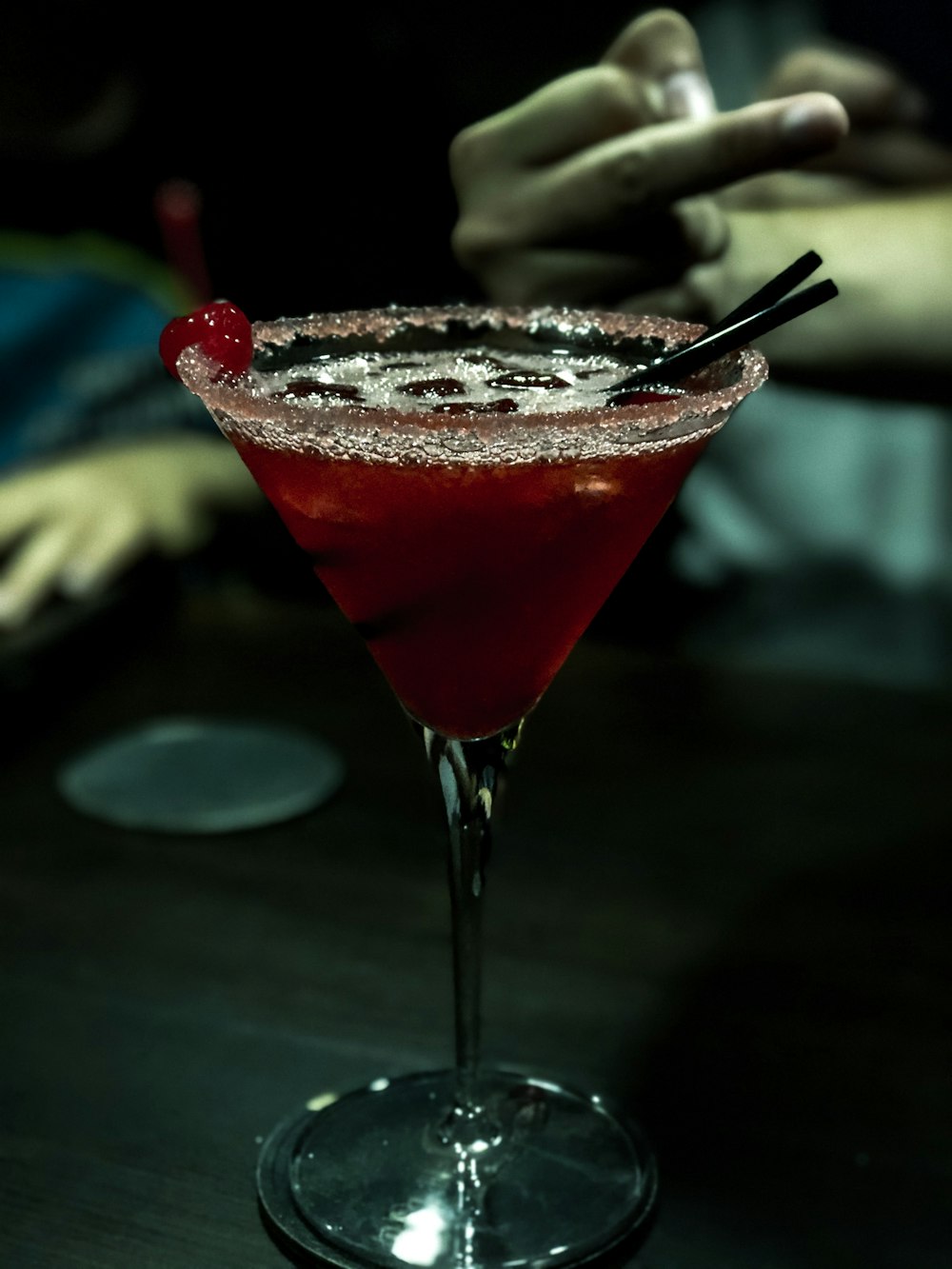 shallow focus photo of red liquid in clear footed wine glass