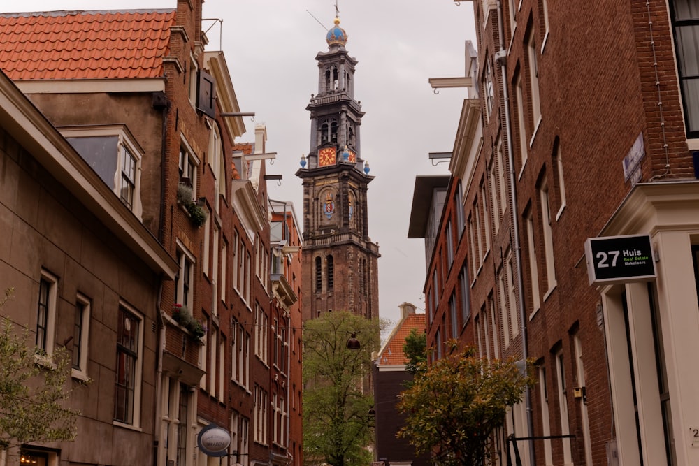 a tall clock tower towering over a city street