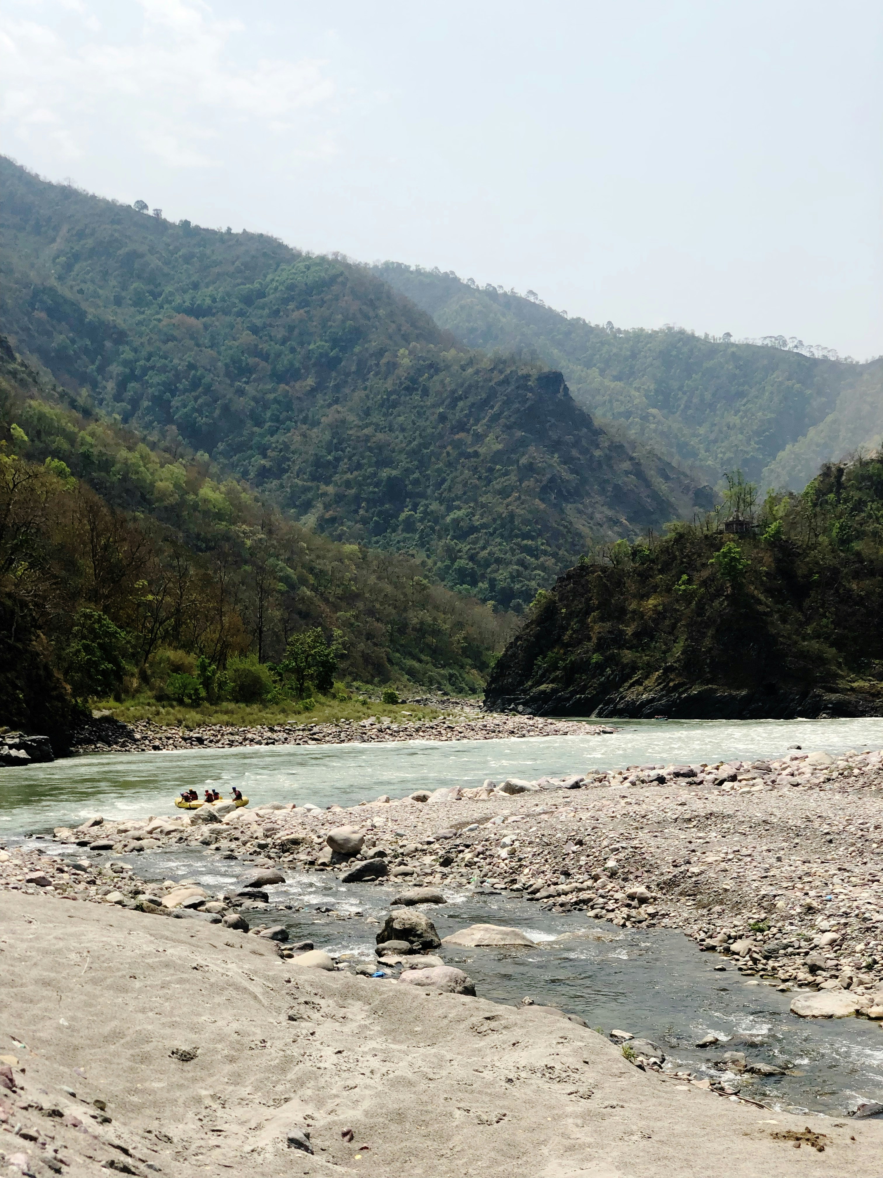 The serene landscape of Jaflong with flowing rivers and lush hills