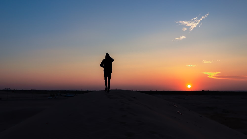 person walks on desert