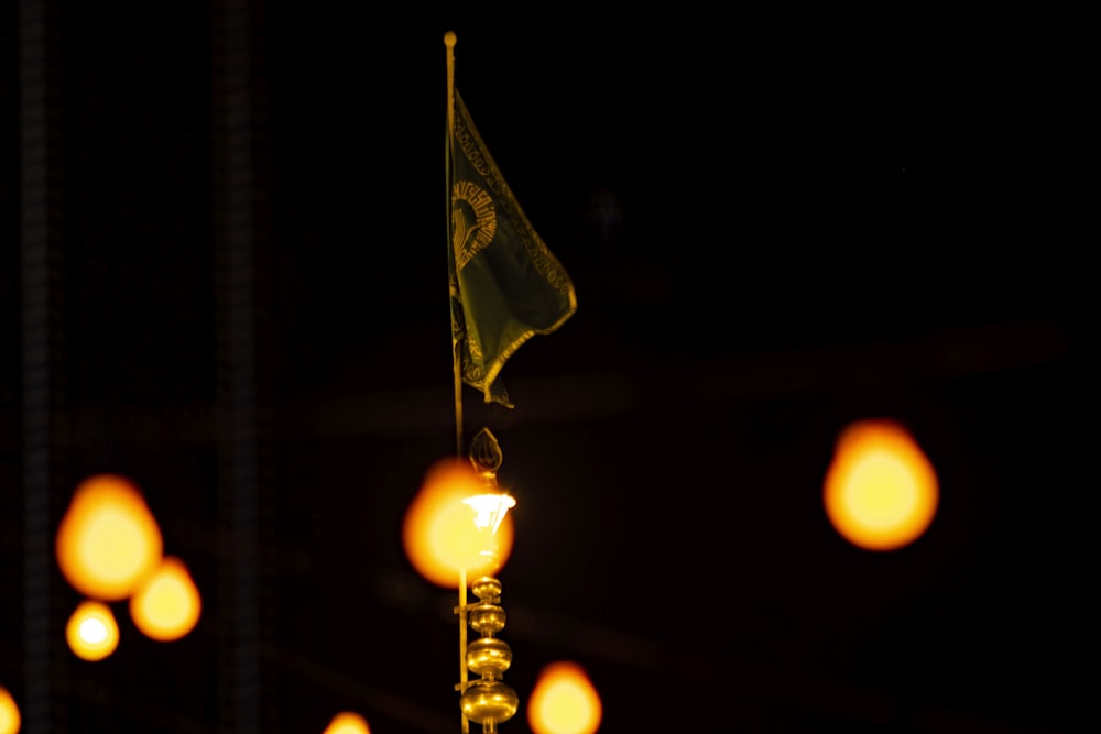 a yellow flag is hanging from a pole