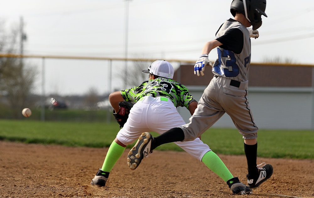 boy about to catch the baseball while the boy runs