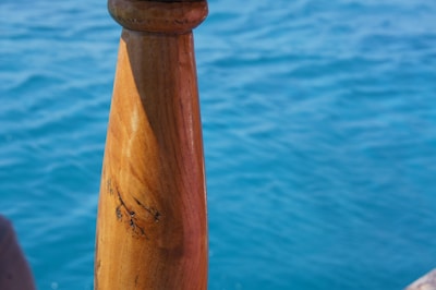Close-up of a freshly installed wooden stair railing with smooth finish.