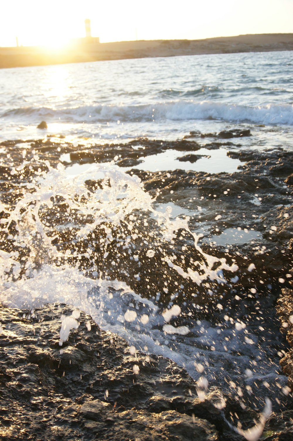 water waves on brown rocks