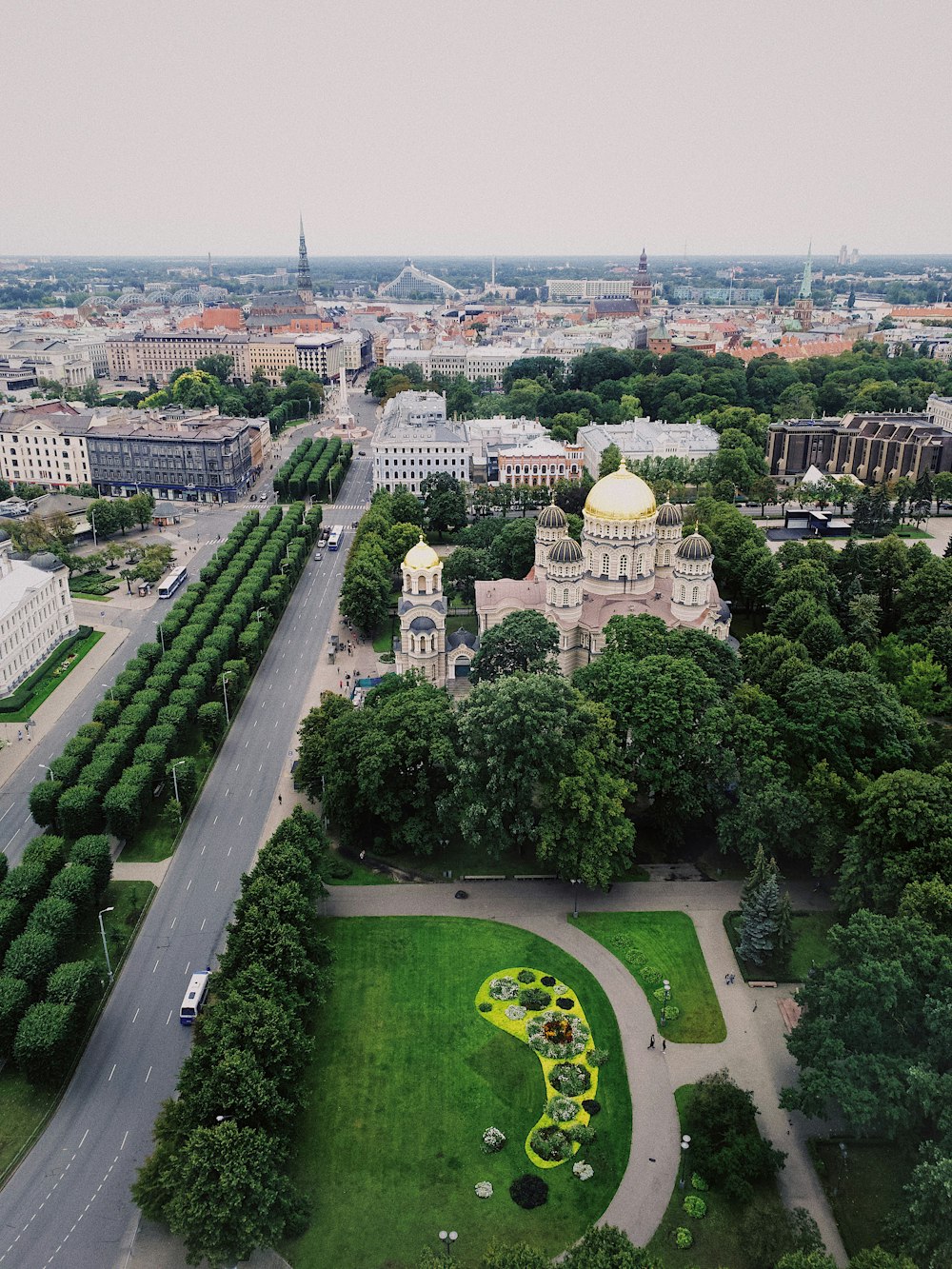 aerial view of city with garden and dome building