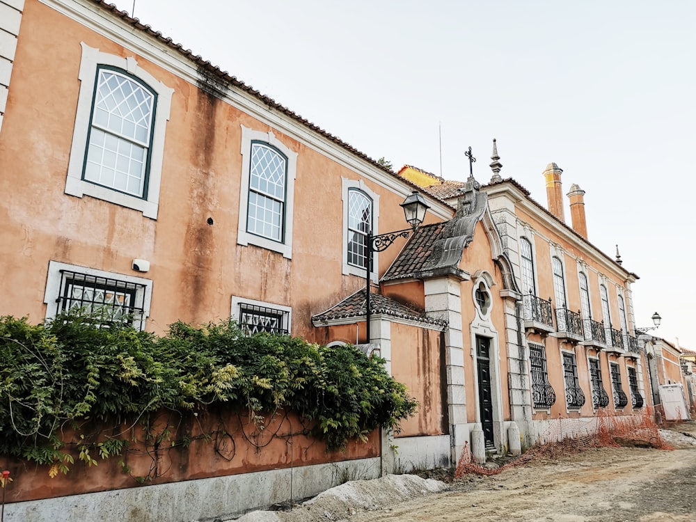 view of beige mansion