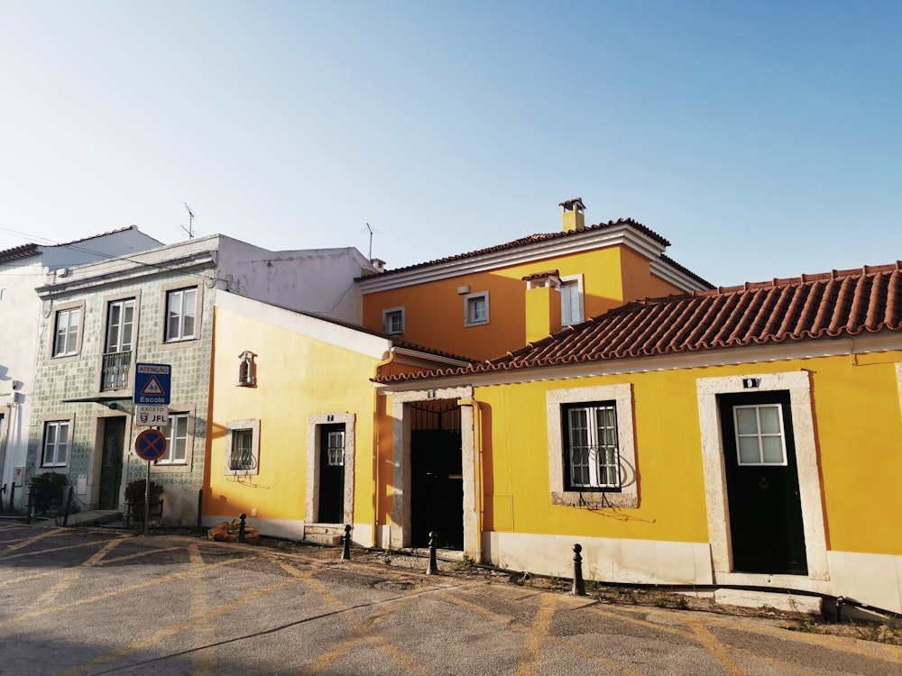 yellow, white, and brown buildings