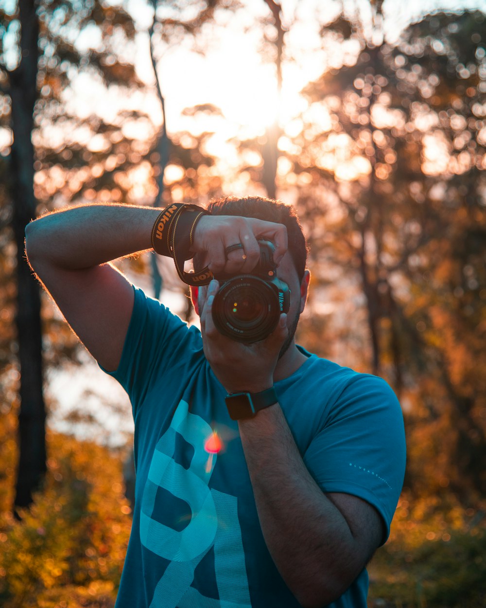 man using DSLR camera