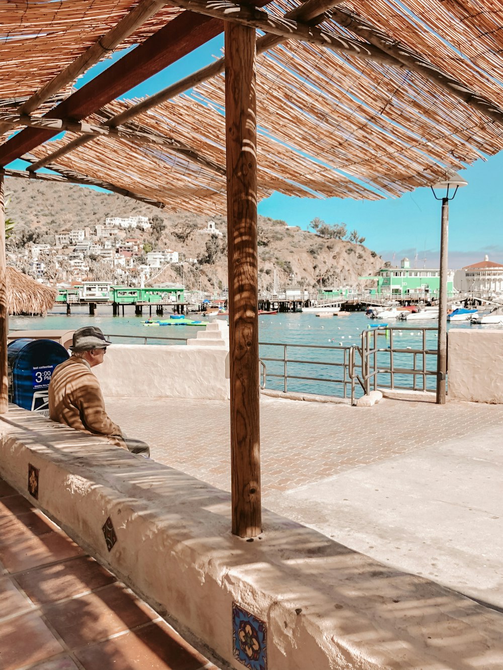 man sitting on a under a canopy tent