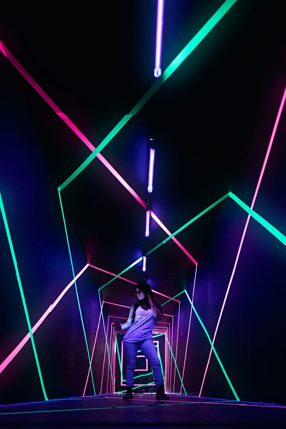 man standing in a LED archway