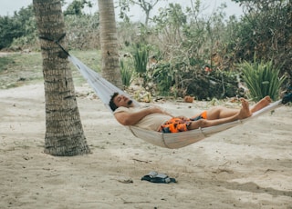 man sleeping on hammock