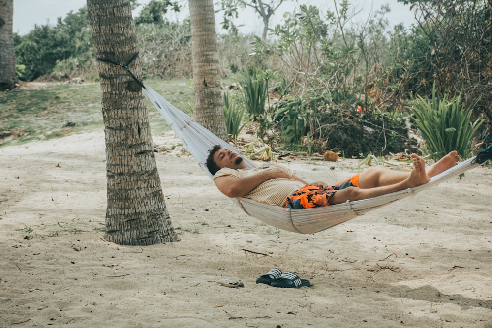 man sleeping on hammock