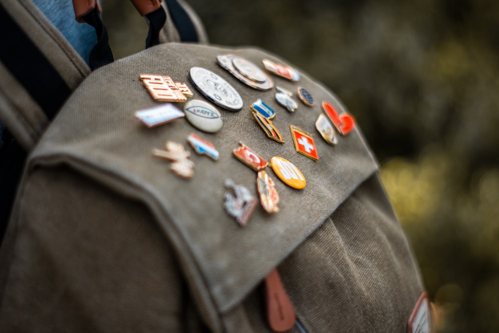 assorted-colored and designed button pins