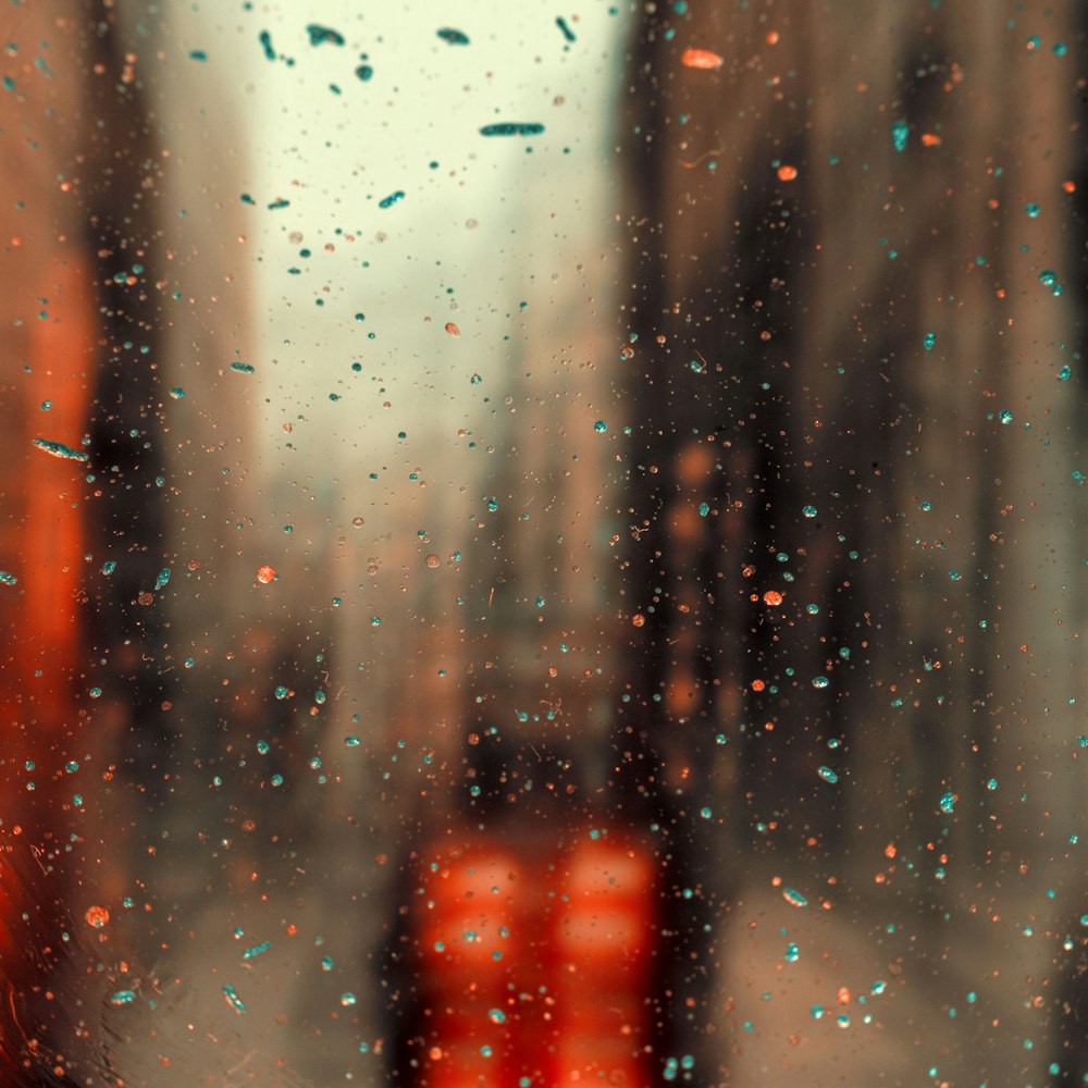 a view of a city through a rainy window