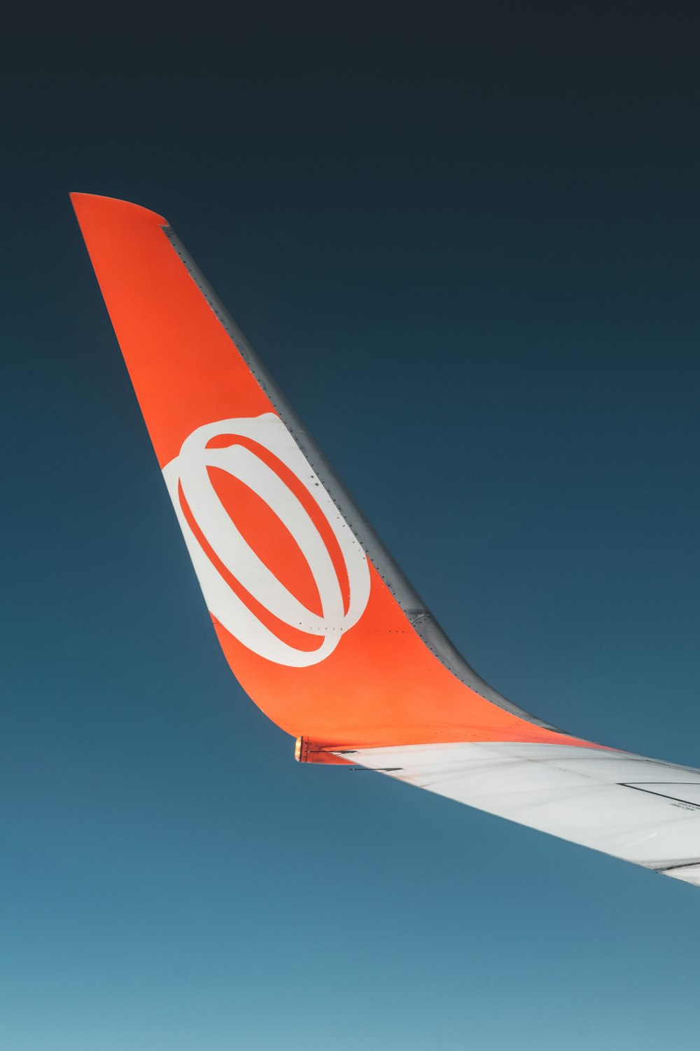 orange and white airplane wing