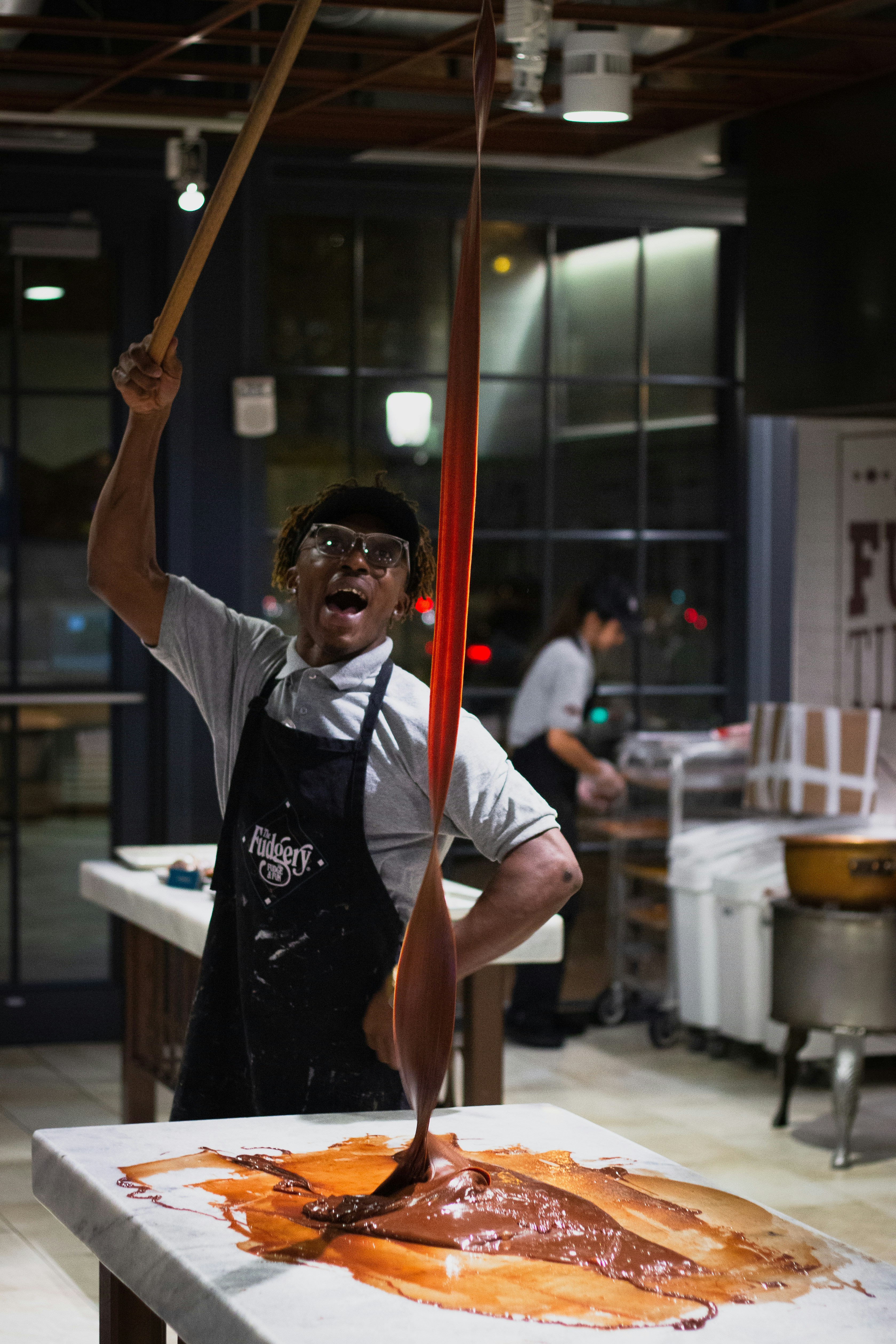 man wears black apron