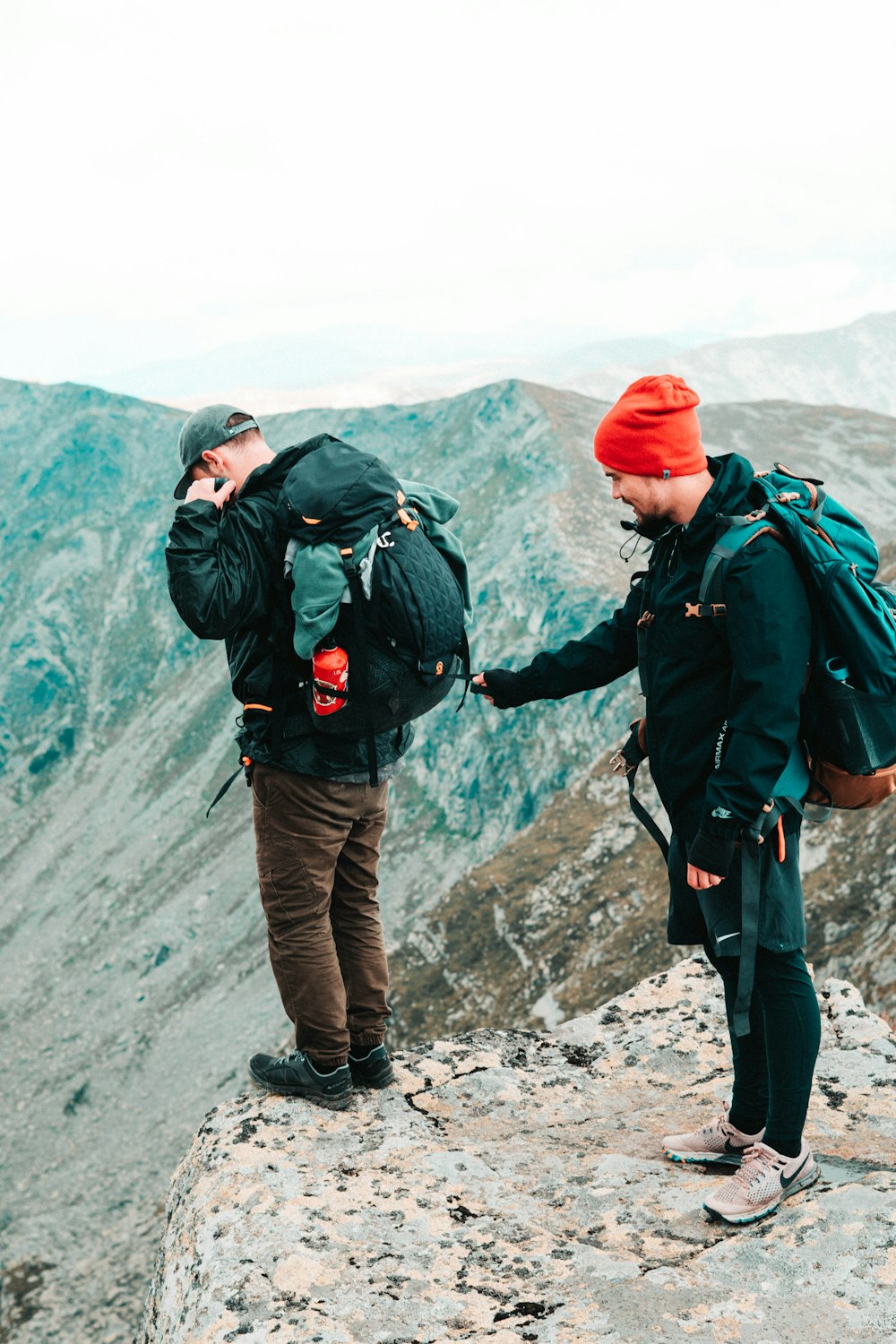 men on cliff