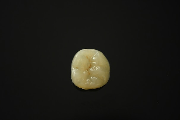 A high-quality dental piece displayed on a clean surface.