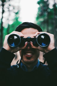 man using binoculars