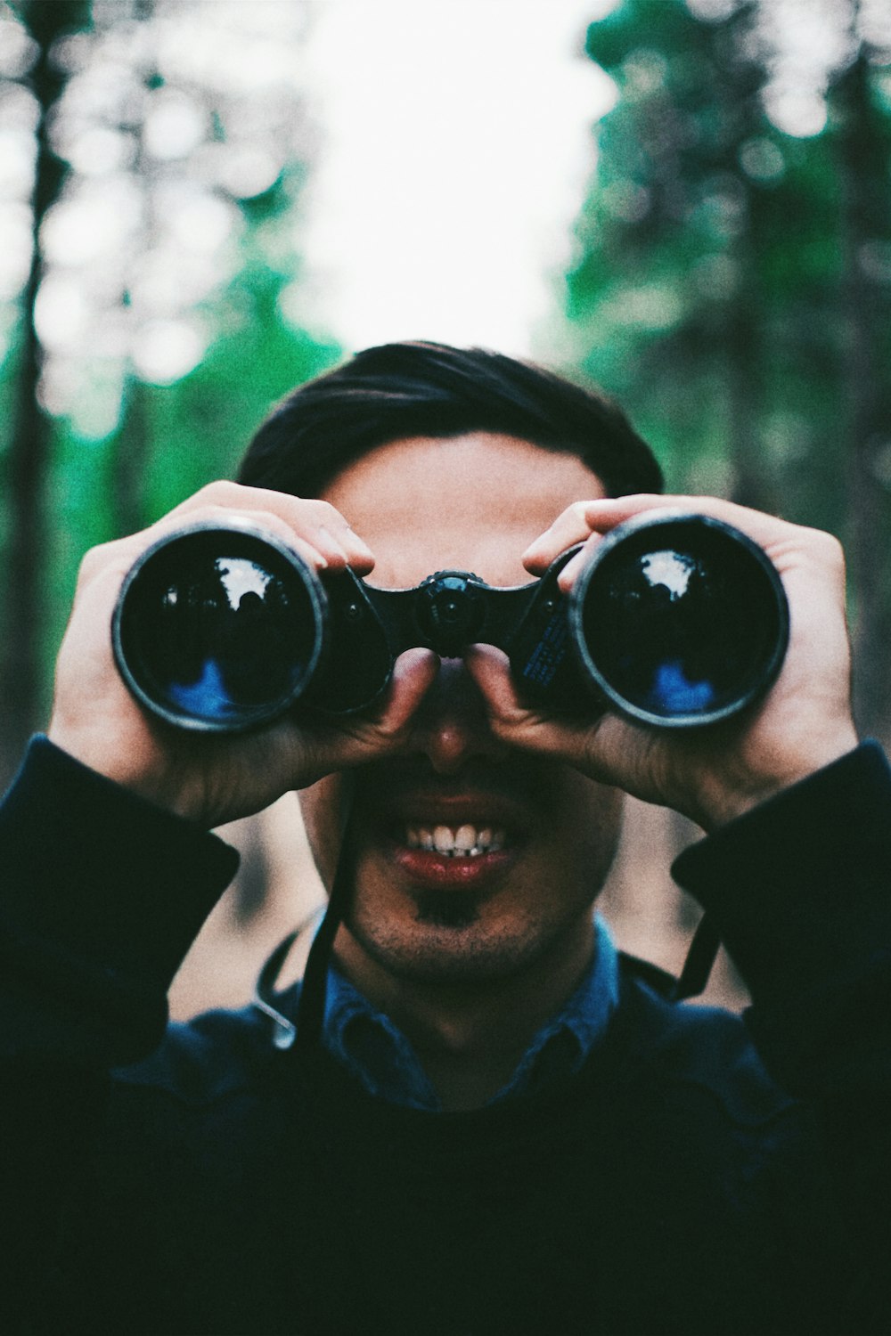 man using binoculars