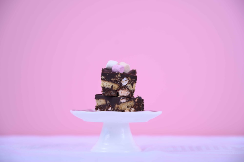 sliced cakes on white footed tray