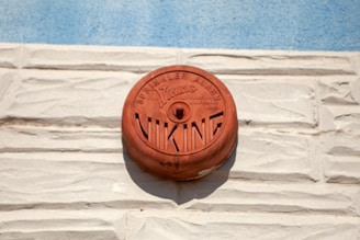 Technician carefully installing a fire alarm system in a modern Kerala building.