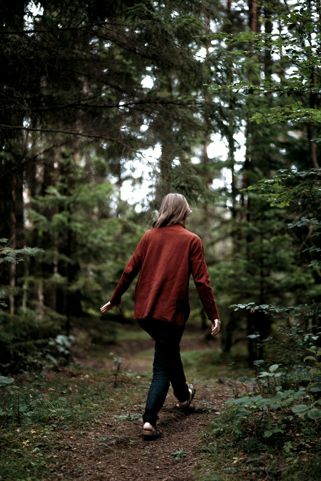 woman walking on forest