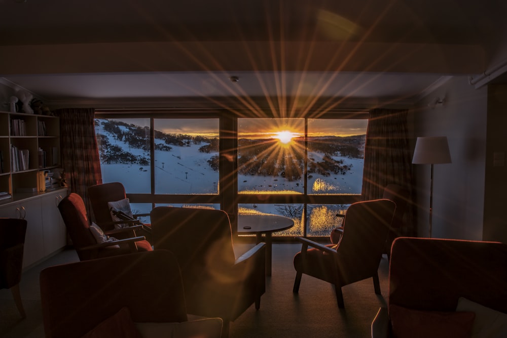 room overlooking a snowy mountain slope