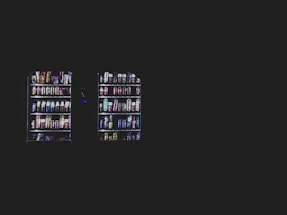 A sleek, modern vending machine with coffee and snacks, set against a clean black and silver background.