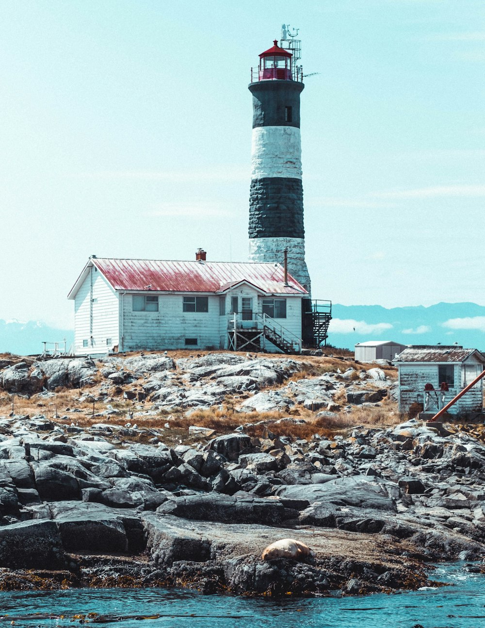 white and black lighthouse photograph