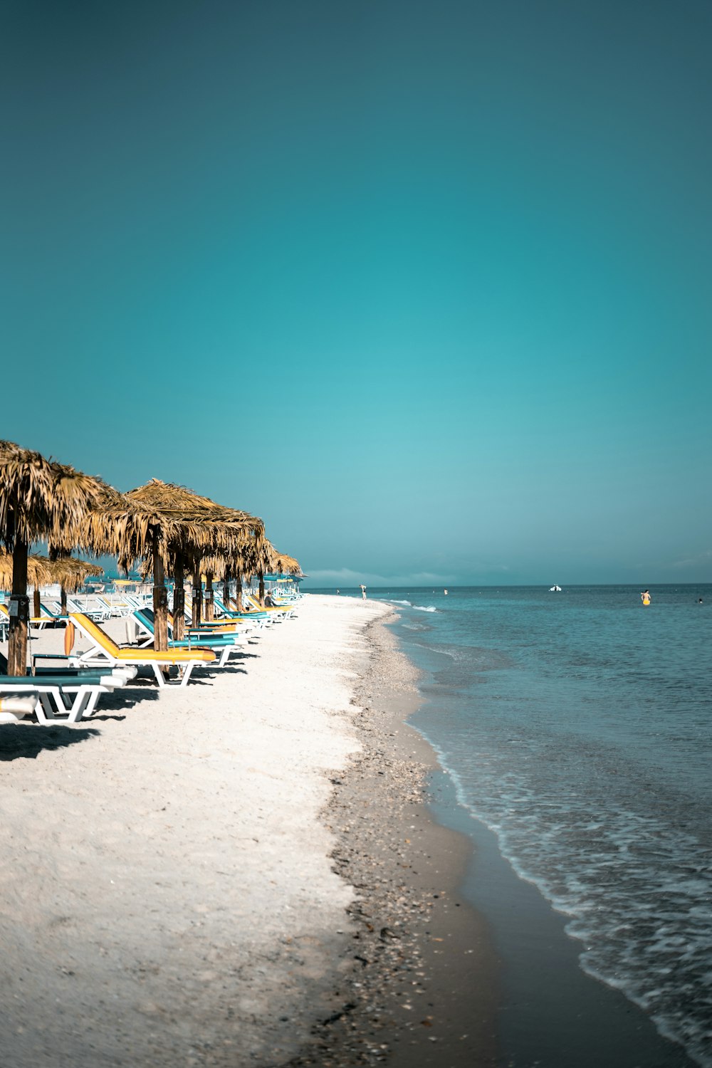 brown wooden beach cottage on beach during daytime