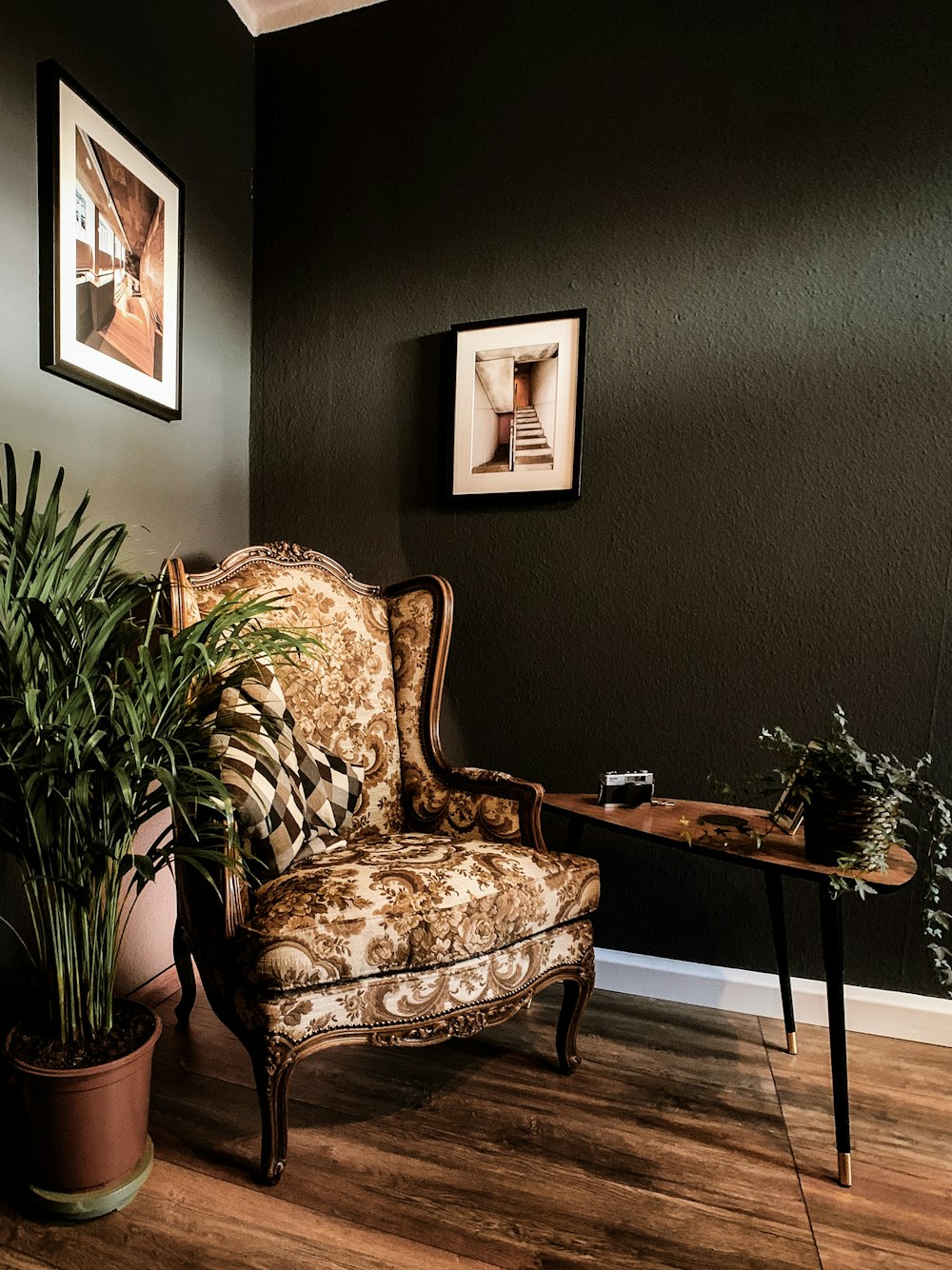 winged chair near console table