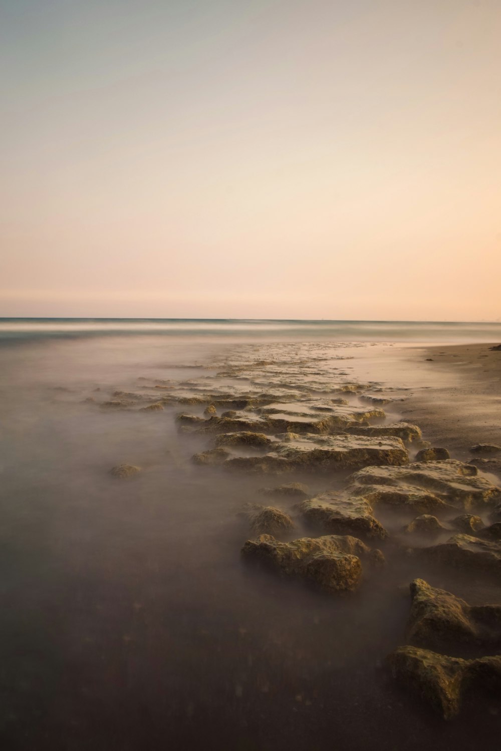 body of water and brown stones