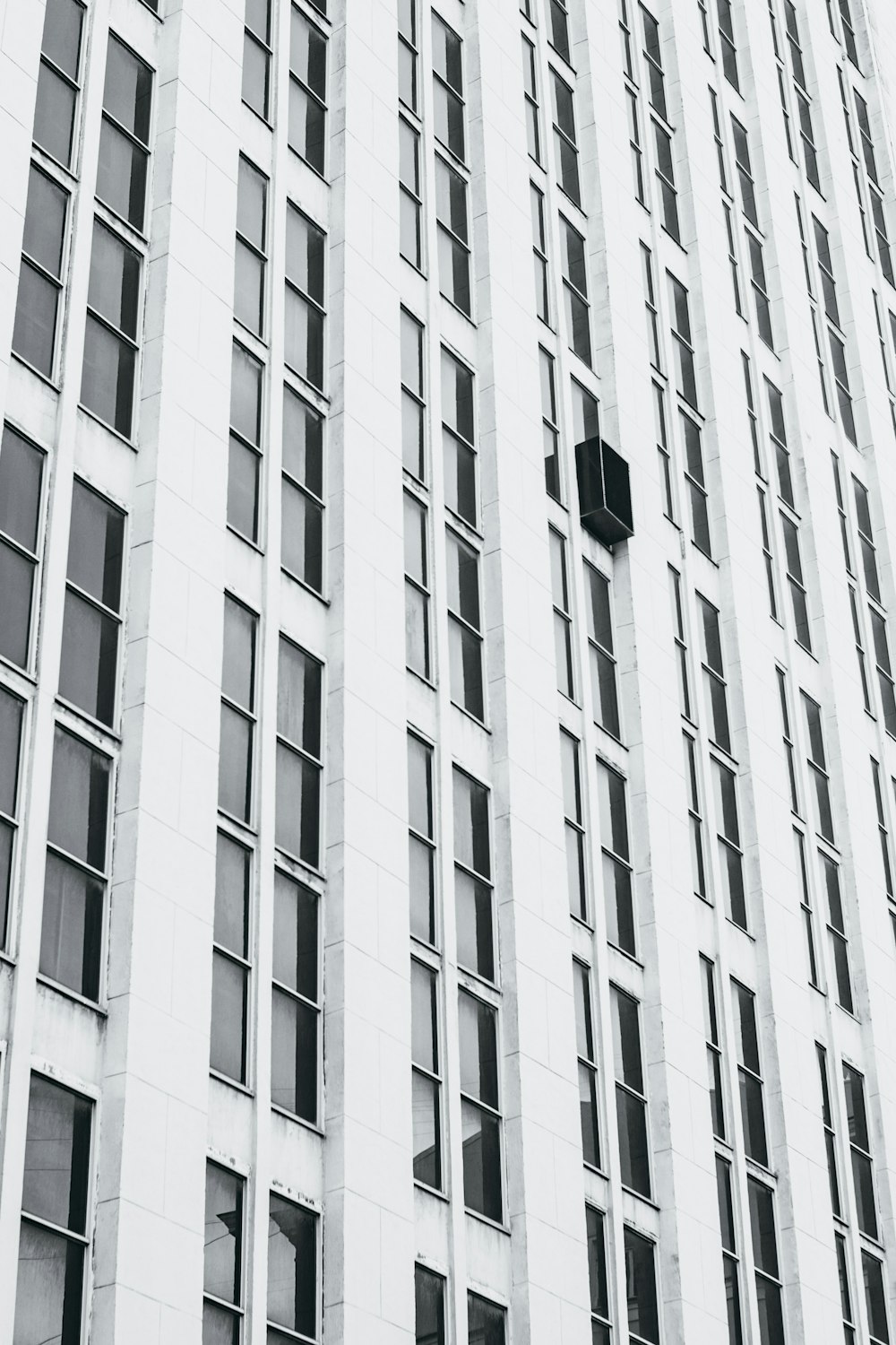 minimalist photography of white high-rise building