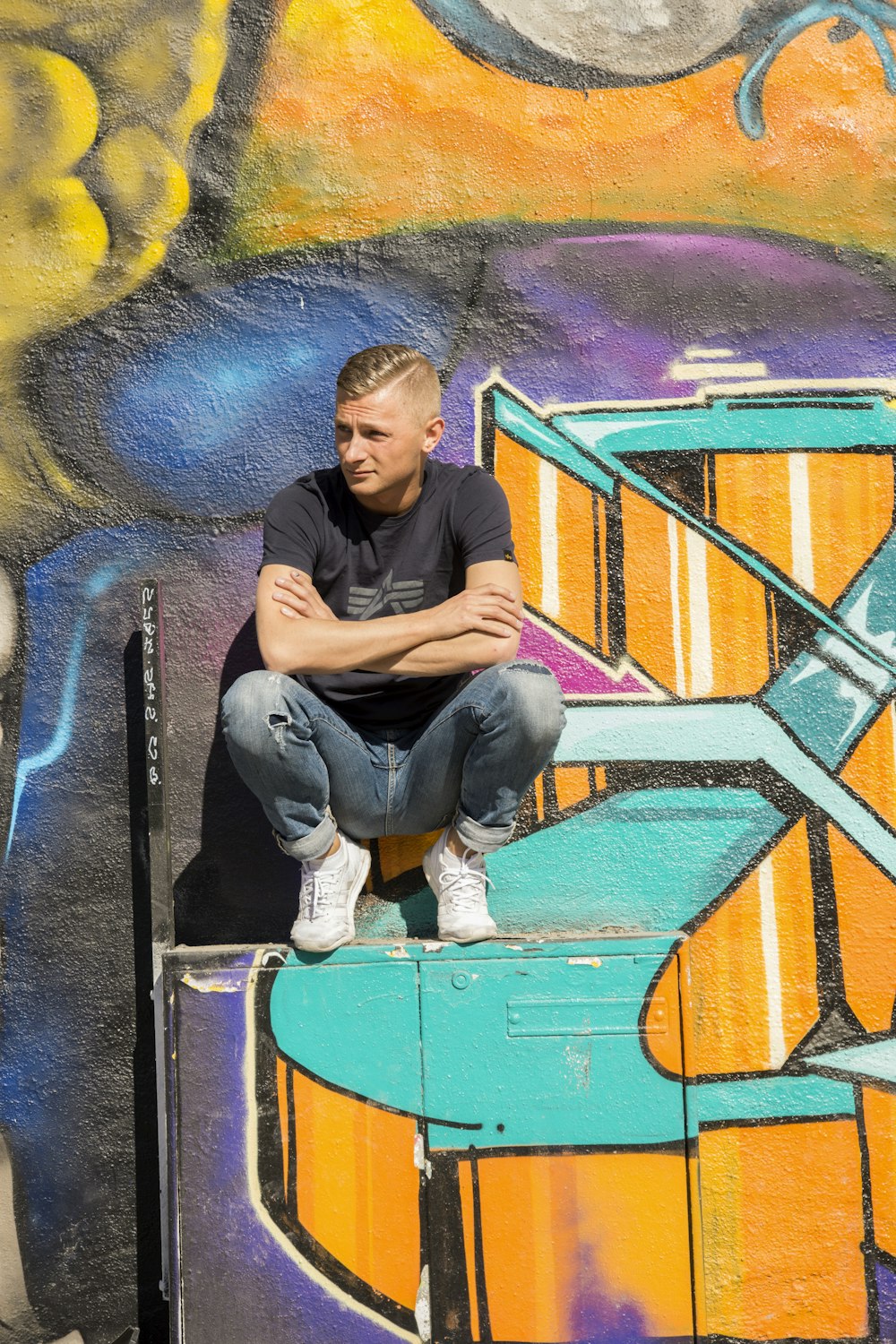 man sitting on container