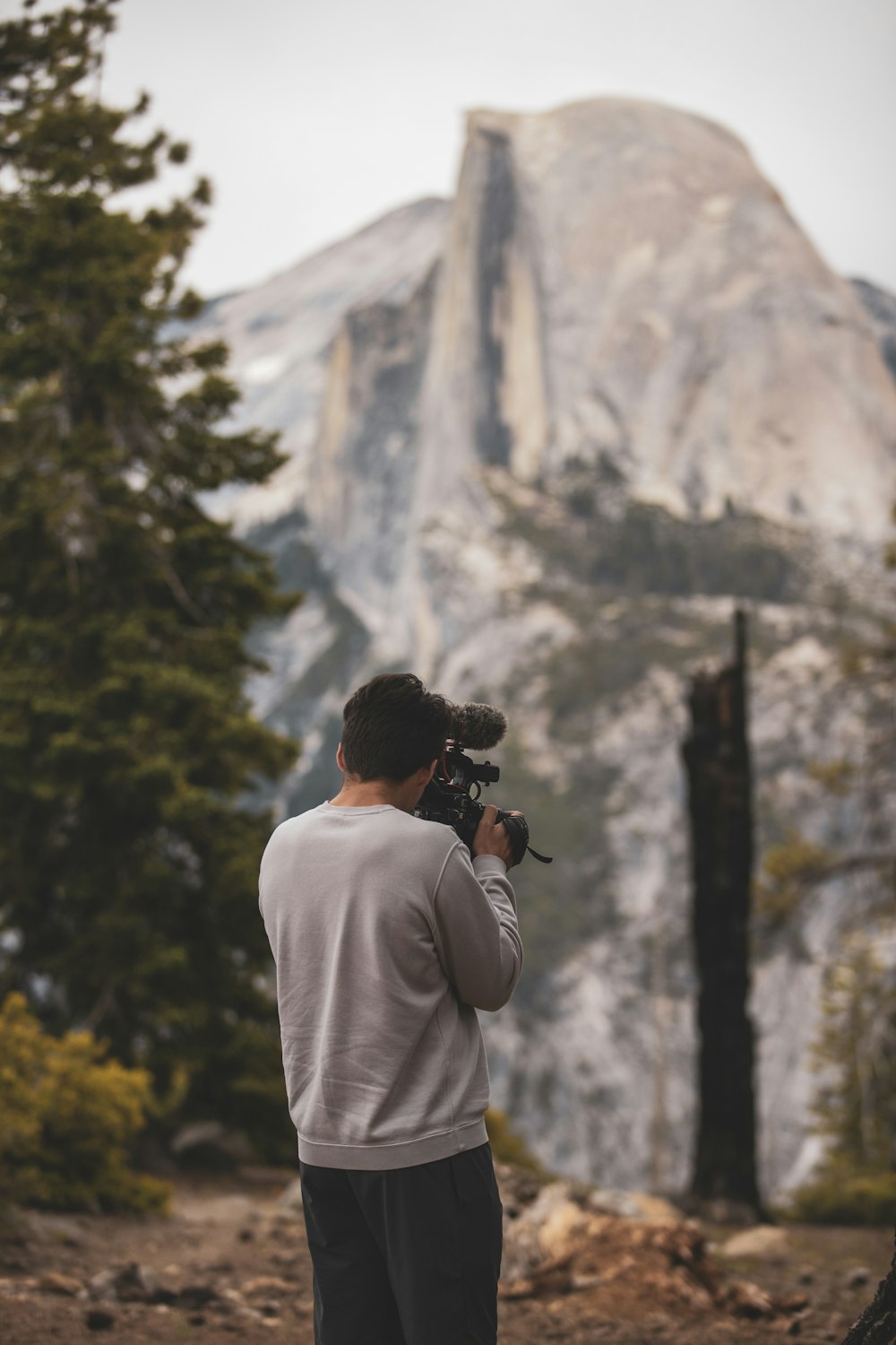 man holding film camera