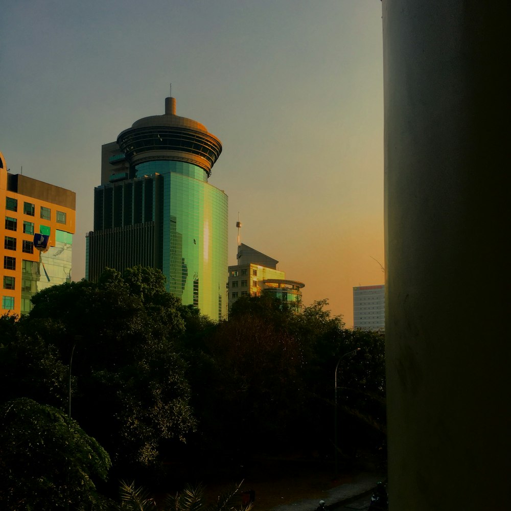 green glass building during daytime