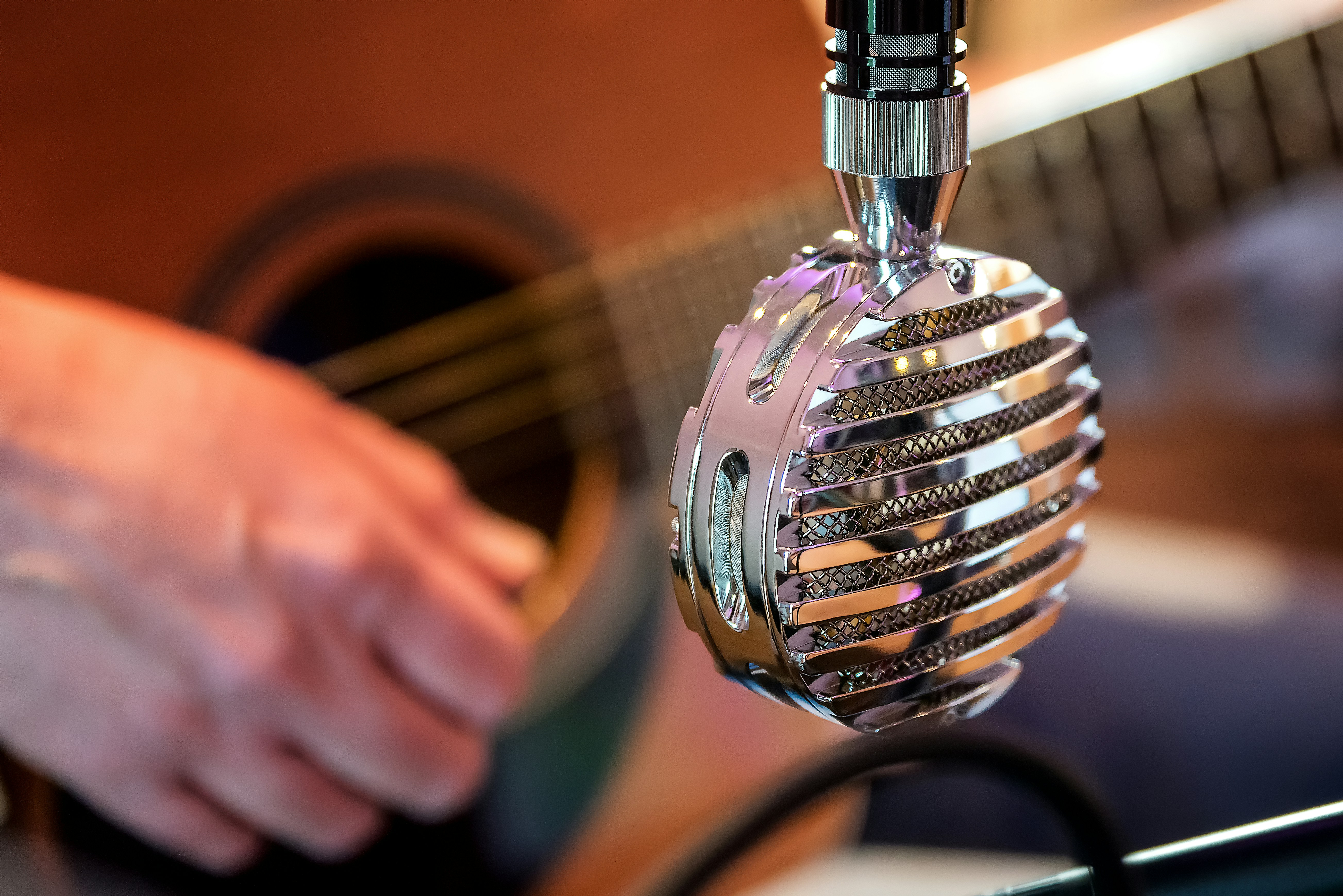 gray metal microphone vanguard zoom background